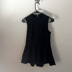 Sleeveless black zip back peplum top